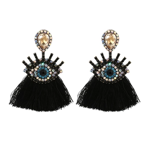 Retro Evil Eye tassel drop earrings with blue crystal accents and black fringe detail