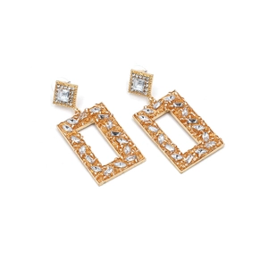 Detailed view of geometric gold alloy earrings with sparkling inlaid rhinestones
