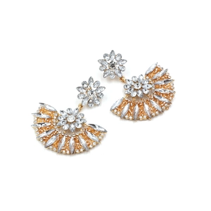Detailed view of fan-shaped drop earrings with clear crystals on gold-tone metal base