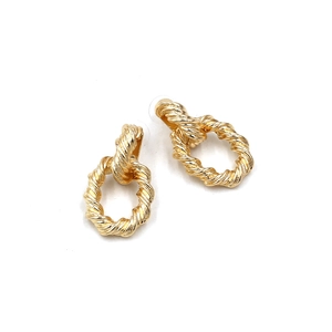 Close-up of gold double hoop earrings featuring a spiral twisted rope texture detail