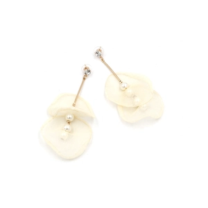 Detail of long lace flower earrings with white pearls and gold tassel on white background