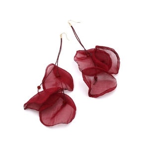 Detail of dark red layered organza flower tassel earrings with gold metal ear hooks