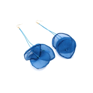 Detail of royal blue lace flower drop earrings with sheer petals and gold hooks