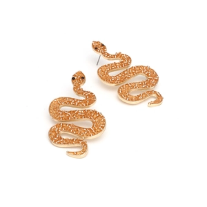 Detailed view of snake-shaped gold earrings with orange beads and black crystal eyes