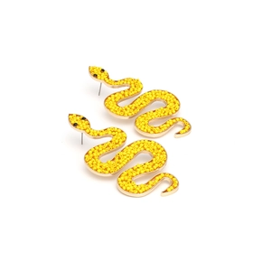 Detailed close-up of golden snake-shaped earrings with yellow beaded texture and black eyes