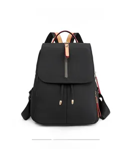 Front view of black waterproof oxford cloth backpack with stylish tricolor shoulder straps