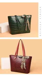 Close-up of crocodile pattern tote bags with leopard scarf details in green and burgundy