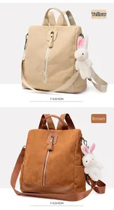 Vertical view of corduroy backpack in brown and yellow with cute rabbit pendant