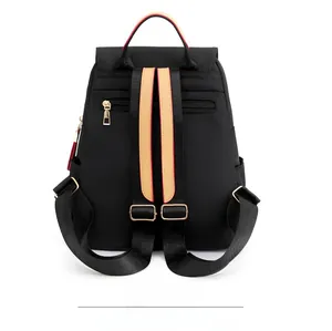 Detail of waterproof Oxford backpack with anti-theft back pocket and tricolor straps