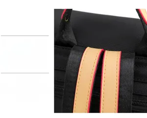 Close-up of durable reinforced stitching and leather trim on waterproof oxford backpack