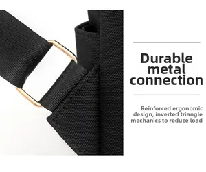 Detail of reinforced triangular stitching and gold metal buckle on black oxford backpack