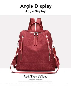Front view of burgundy corduroy backpack with vertical zipper pockets and rivets
