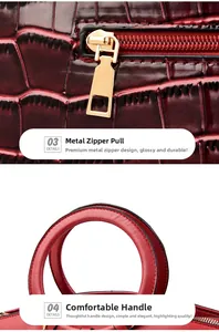 Détail du sac à main en cuir bordeaux motif crocodile avec fermeture éclair dorée et anse