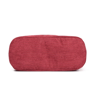 Deep red corduroy backpack base showing detailed texture and oval bottom structure