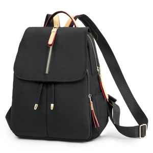 Waterproof black oxford travel backpack with contrast pullers and gold-tone hardware