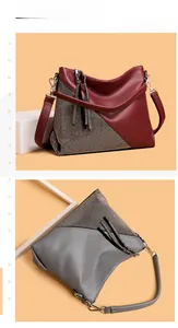 Détail du sac à bandoulière avec épissure de strass et tirettes de zip à franges