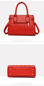 Rear view with zipper pocket and bottom detail with metal studs on red quilted shoulder bag
