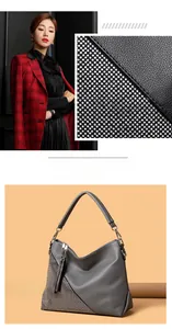 Détail du sac bandoulière gris avec franges en strass et finition en cuir élégante
