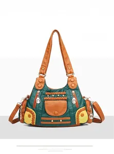 Detailed front view of green vintage washed leather tote bag with multi-pocket design