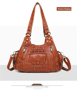 Detailed view of brown PU leather tote bag with woven sides and metal rivets decoration