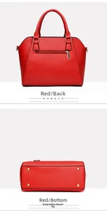 Detailed view of red leather handbag showing back zipper pocket and golden bottom studs