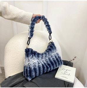 Detail showing plush ombré blue and white faux fur texture with vertical pleats