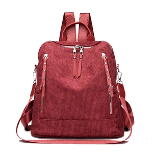 Deep red corduroy backpack for women featuring large capacity and dual zipper design