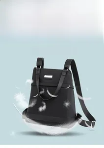 Detail of lightweight black nylon backpack weighing only 0.25KG with feather design