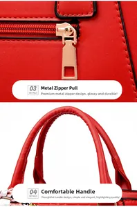 Close-up of red embossed handbag featuring gold zipper pulls and reinforced curved handles