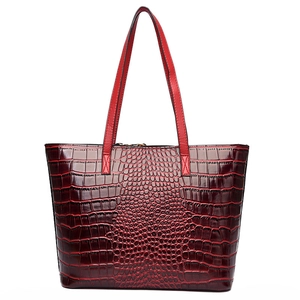 Large burgundy crocodile pattern tote bag with shoulder straps and top zipper closure