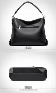 Détail de la poche zippée arrière et de la base multi-matériaux du sac à main noir