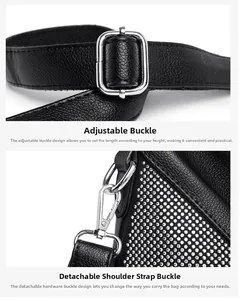 Détail de boucles argentées réglables et fermoir mousqueton sur sac en cuir noir grainé