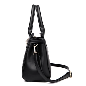 Black quilted large capacity shoulder bag with double handles and gold hardware