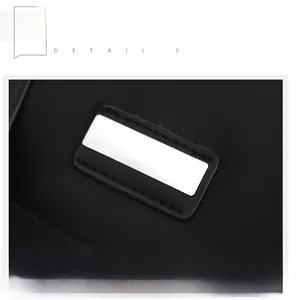 Close-up of silver metal logo and high-quality stitching on black oxford backpack