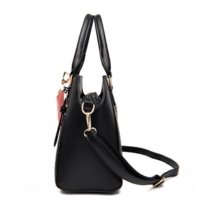 Black leather handbag with bow scarf detail and adjustable strap for women