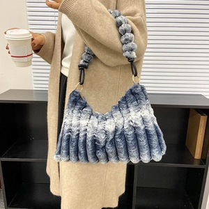 Blue and white gradient plush shoulder bag with striped texture and furry ball strap