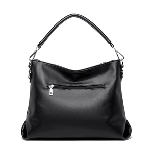 Sac fourre-tout en cuir grainé noir avec poignées et finitions argentées sur fond blanc