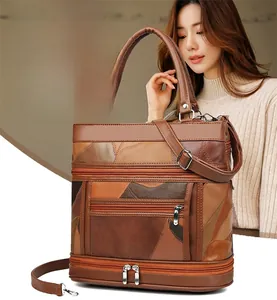 Detail of vintage patchwork brown leather handbag featuring functional multi-zipper pockets