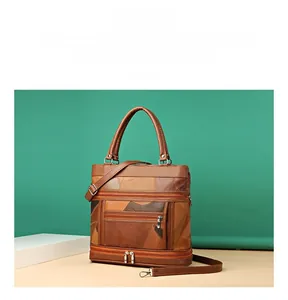 Detailed view of color-block vintage faux leather bag with multiple zipper pockets