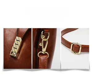 Detail of brown oil wax leather bag featuring golden metal lock and adjustable shoulder strap
