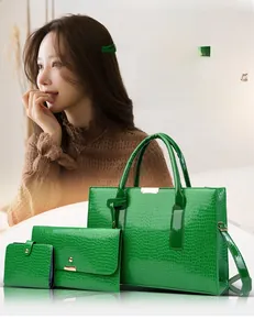 Three-piece vibrant green faux crocodile leather handbag set with gold hardware detail