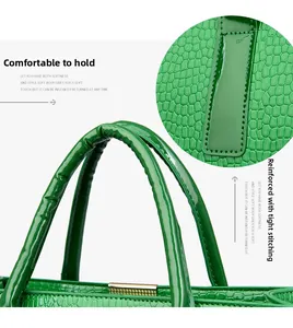 Detail of bright green crocodile pattern tote with reinforced stitching and comfortable handles