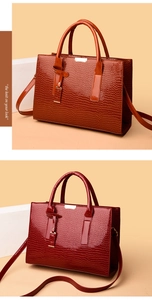 Detail of high-gloss faux crocodile leather tote bags in brown and wine red with gold hardware