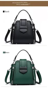 Detail view of the retro bucket bag showing metal lock and V-stitch texture in black and green