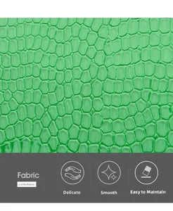 Close-up of green crocodile texture faux leather material showing smooth and fine surface