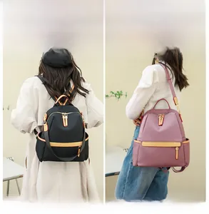 Dual-use nylon backpack showing both double-shoulder and single-shoulder carrying styles