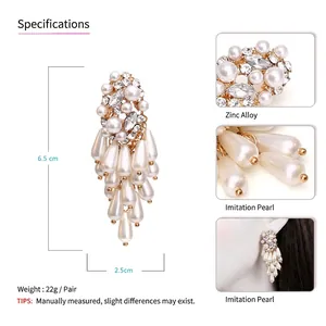Exaggerated silver-tone pearl tassel earrings with rhinestones for a bold statement look