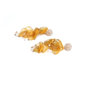 Exaggerated mustard yellow fabric flower drop earrings with pearl stud and petal details
