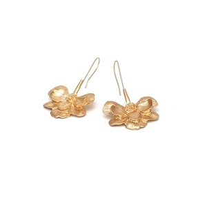 Vintage long gold floral drop earrings with textured petals and matte metal finish