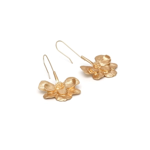 Vintage long gold flower earrings with brushed metal finish and detailed petals